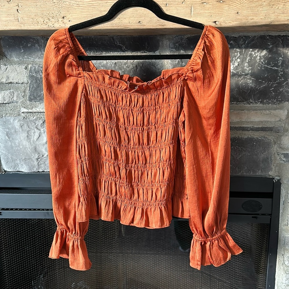 Burnt orange smock long sleeve top. Great condition!